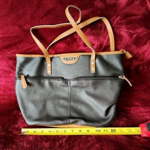 Women's black handbag with brown trim lots of pockets and space